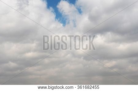 Clouds Swiftly Swim Through The Blue Sky Of The Day
