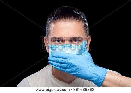 Mute Male Portrait Doctor In Medical Mask And Surgical Glove Cover His Mouth With His Hand Isolated 