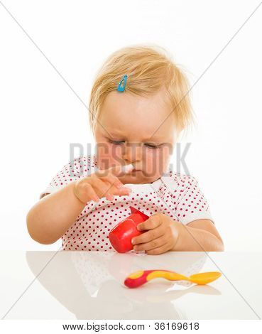 Cute Infant Girl Learining To Eat With Spoon