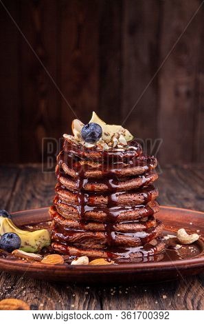 Vegan Pancakes Based Avocado With Cocoa And Date Syrup. Vegan Healthy Sweet Food.  Copy Space
