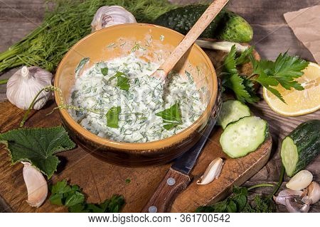 Dip Sauce Appetizer Tzatziki Of Cucumber, Yogurt, Garlic, Lemon And Dill. Creece Cuisine. Old Wooden
