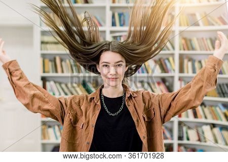 Funny Portrait Of Pretty Brunette Young Caucasian Girl, Student, In Brown Casual Shirt, Posing On Th
