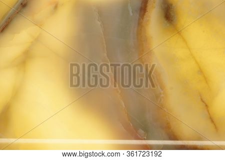 Polished Yellow Natural Stone With A Red Pattern, Backlit, Called Onyx