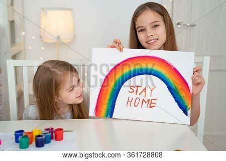 Kids Girls Drawing On A White Sheet Rainbow And Write Stay Home. Flashmob Chasetherainbow.