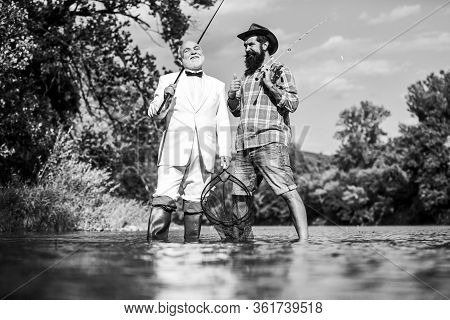 Friends Fishing. Elegant Bearded Man And Brutal Hipster Fishing. Perfect Weekend. Family Day. Summer