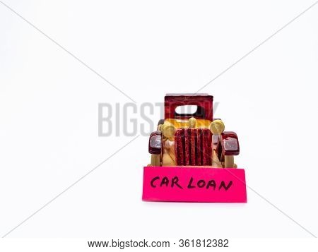 Front Shot Of A Wooden Toy Car With White Background And Copy Space In Loan Concept