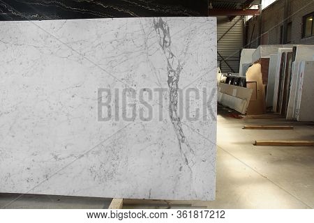 A Slab Of Natural White Marble With Gray Veins In A Stone Warehouse Is Called Bianco Gioia