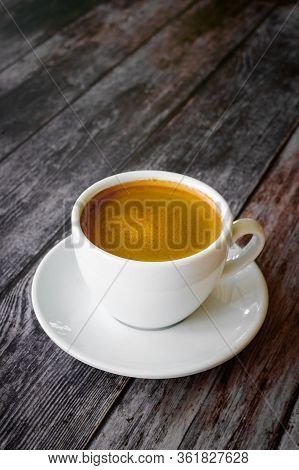 Hot Coffee Americano On The Old Wooden Table
