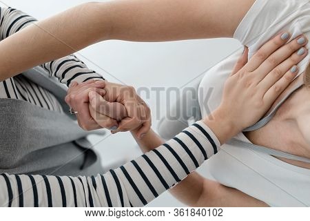 Close-up Of Two Women Exercising Together During Bioenergetic Therapy