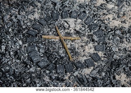 Norse Rune Nautiz On Ashes Backgorund Inside The Circle Of 24 Norse Runes