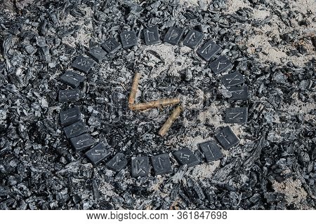 Norse Rune Sowilo On Ashes Backgorund Inside The Circle Of 24 Norse Runes