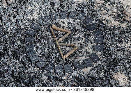 Norse Rune Berkana On Ashes Backgorund Inside The Circle Of 24 Norse Runes
