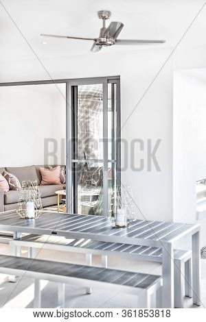 Modern Dining Area Close Up From The Outside Near To Living Room Entrance Of A Luxury  House, Table 