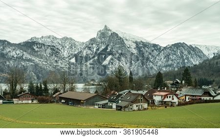 Small Austrian Village By Traunsee Lake With Snow Mountain Traunstein In Austria