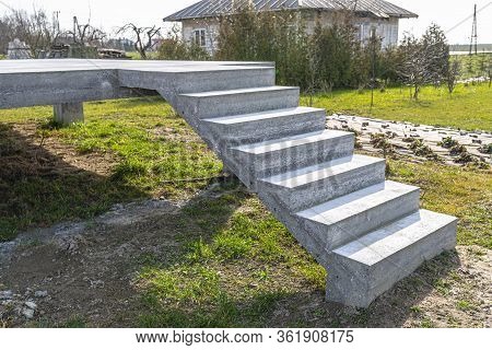 Concrete Rectangular Structure On Concrete Poles With Stairs In Raw Condition, Standing In A Field I