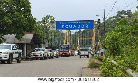 La Hormiga, Putumayo / Colombia - March 8 2020: Buses And Cars Crossing The International Bridge Ove