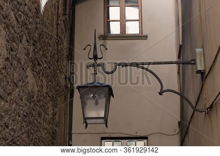 The View Of An Ancient Street Lantern On A House Wall.