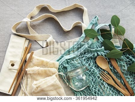 Net Bag With Reusable  Glass Jars, Fruits And Bamboo Cutlery. Zero Waste Concept. Eco Friendly. Flat
