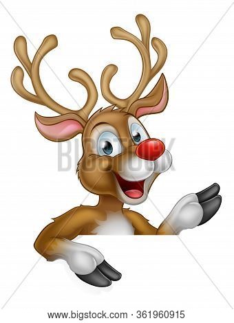 Cute Cartoon Christmas Reindeer Peeking Over And Pointing At A Sign