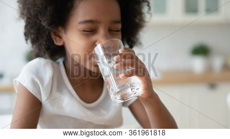 Little Biracial Girl Drink Pure Mineral Water