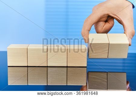 Wooden Cubes On A Blue Background