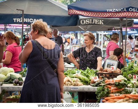 Osijek, Croatia - August 26, 2017: Traditional Scene Of The Osijek Green Market With Old Women Selli