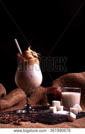 Cold Trendy Drink Korean Dalgon Iced Coffee On A Dark Background. Delicious And Popular Coffee In Th