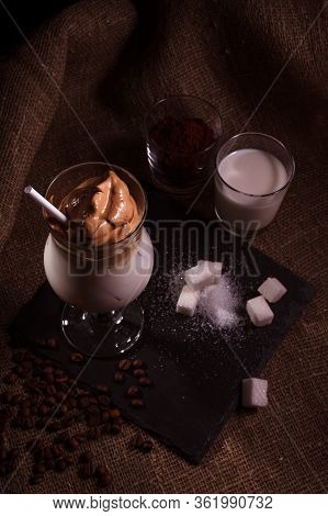 Cold Trendy Drink Korean Dalgon Iced Coffee On A Dark Background. Delicious And Popular Coffee In Tr