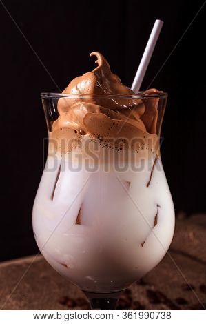 Iced Korean Dalgona Coffee, A Trendy Fluffy Creamy Whipped Coffee With White Tube And Ice. Trendy Co