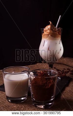 Cold Trendy Drink Korean Dalgon Iced Coffee On A Dark Background. Delicious And Popular Coffee In Th
