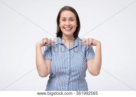 Happy Mature Woman Pointing Fingers At Herself. Select Me Please Concept.