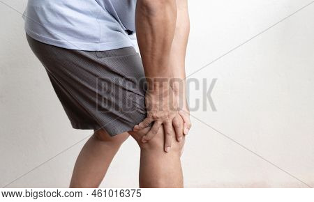 Man Hand Massage Physiotherapy Her Knee Is Sore And Numb, Exhausted, Tingling. Guillain-barre Syndro