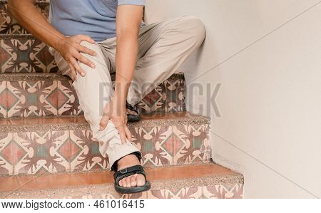 Man Hand Massage Physiotherapy Leg Is Sore And Numb, Exhausted, Tingling. Guillain-barre Syndrome, A