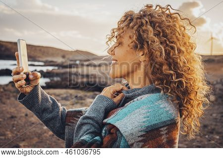 Side Portrait Of Beautiful Woman Using Mobile Phone Outdoor With Internet Voice Connection. Modern T