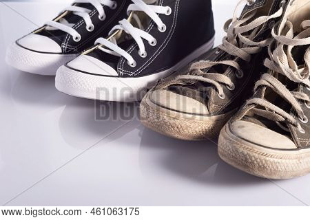 Old And New Classic Sneakers On A White Background.