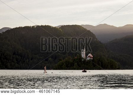 Watersport Activities On Lake Bled, Slovenia With The Church In The Background