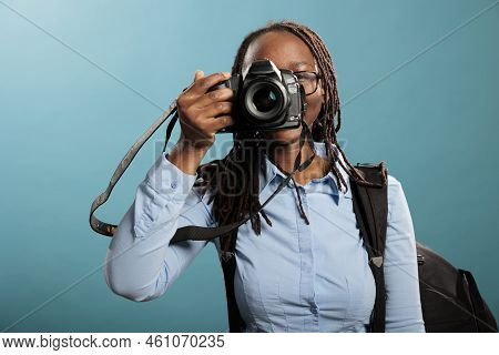 Professional Photographer With Photographing Modern Device Taking Pictures While Looking At Camera O