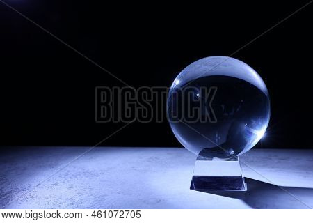 Crystal Prediction Ball On Table In Darkness, Space For Text. Fortune Telling