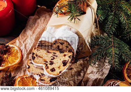 Christmas Stollen On Wooden Background. Traditional Christmas German Dessert Cut Into Pieces. Cake W