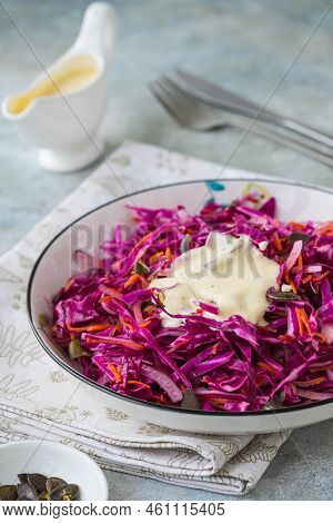 Coleslaw Salad Of Red Cabbage And Carrots With Mayonnaise Dressing In A White Bowl On A Gray Concret