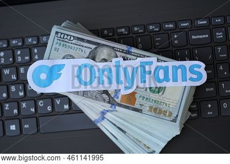 Ternopil, Ukraine - September 6, 2022 Onlyfans Paper Logotype On Bunch Of Us Dollar Bills Lies On Bl