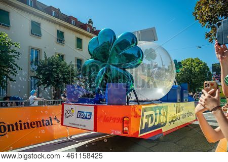 Aigle, Valais Canton, Switzerland -july 10, 2022: Passage Of An Advertising Car Of Groupama Fdj In T