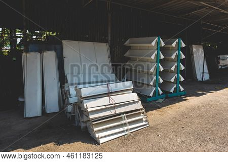 Empty Old Metal Book Or Magazines Shelves. Old Bookshelves That Are No Longer In Use Due To The End 