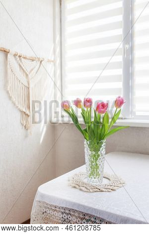Beautiful Pink Tulips In Glass Vase Against Handmade Macrame Wallhanging.  Eco Friendly Modern Conce