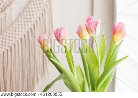 Beautiful Pink Tulips Against Handmade Macrame Wallhanging.  Eco Friendly Modern Concept In The Inte