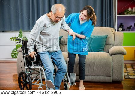 Doctor Support Old Man To Getting Up To Exercise, Help Handicapped Elderly Stand Up, Asian Woman Nur