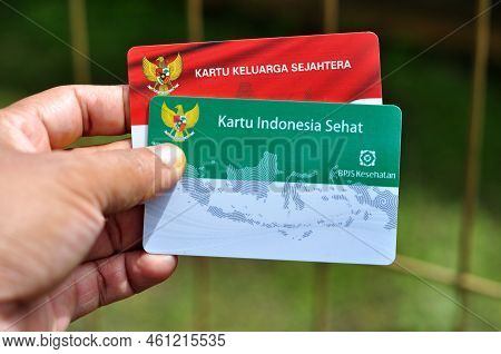 Jakarta, Indonesia - September 9, 2022 : Holds A Prosperous Family Card And Healthy Indonesia Card A