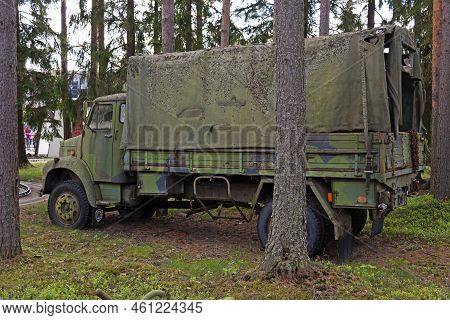 Powerpark, Finland - June 20, 2022: Military Truck With Camouflage In Small Forest Lot
