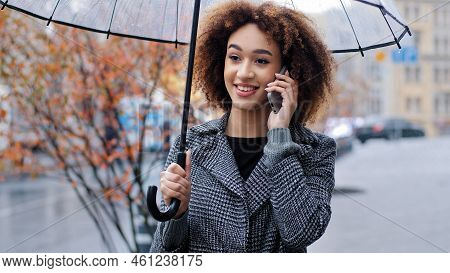 Happy Active Friendly Curly Haired Girl African American Woman With Transparent Umbrella In City In 