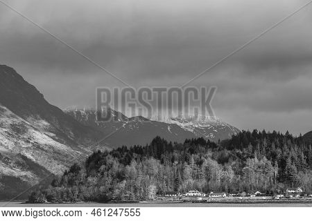 Black And White Beautiful Winter Landscape View Along Loch Leven Towards Snowcapped Mountains In Dis